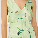 Light green dress with floral pattern worn by a person