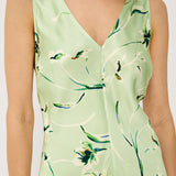 Light green dress with floral pattern worn by a person