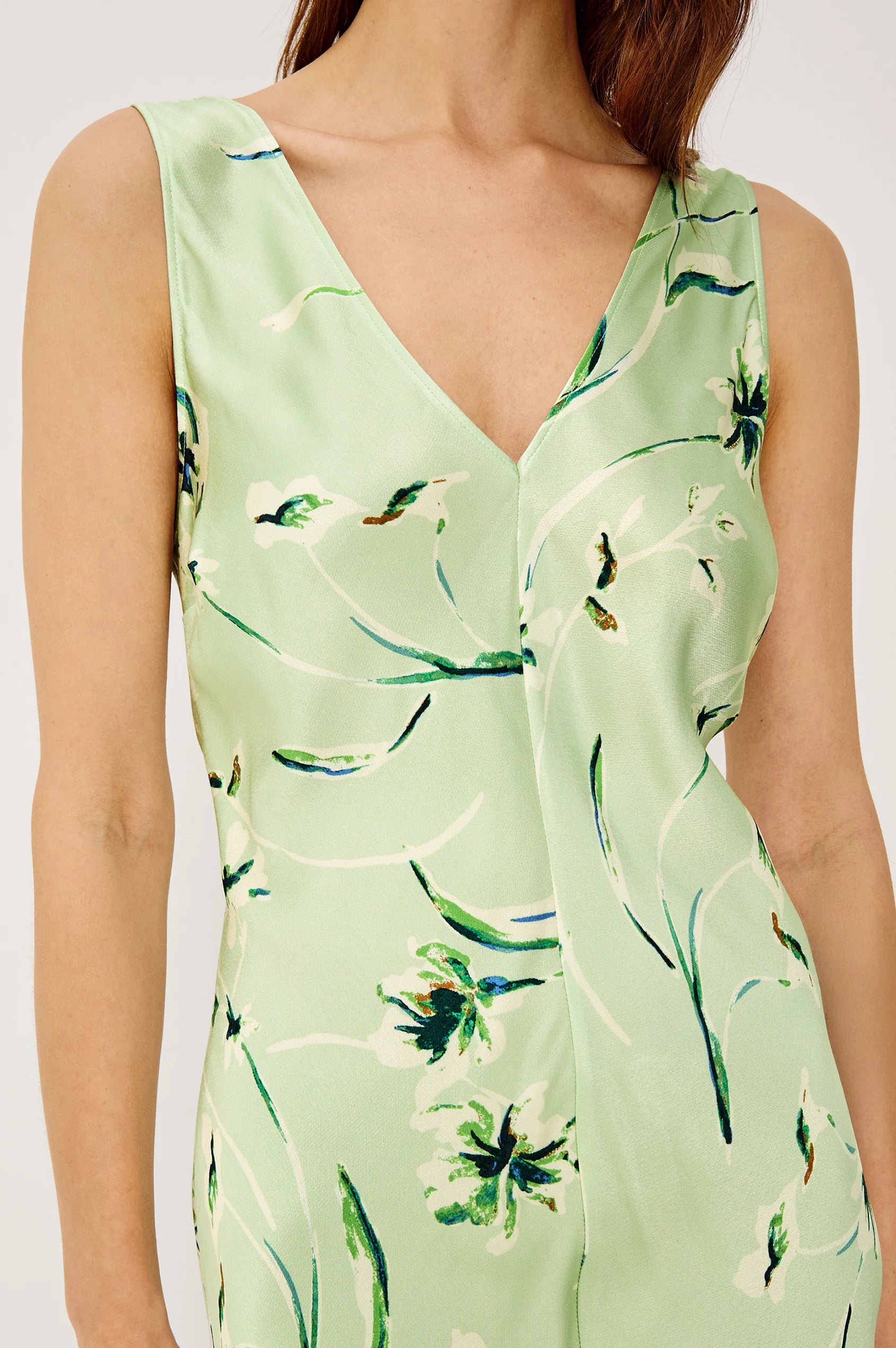 Light green dress with floral pattern worn by a person
